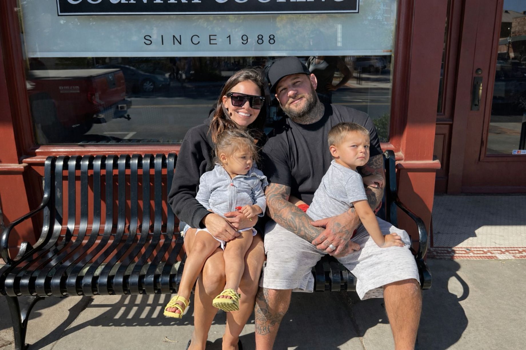 The Nunes family on a bench in downtown Lincoln, California