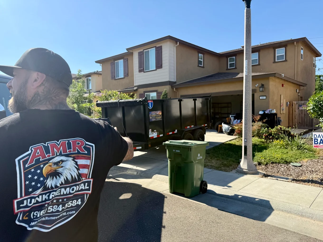 AMR Junk Removal crew on the job in Lincoln, CA with the company trailer